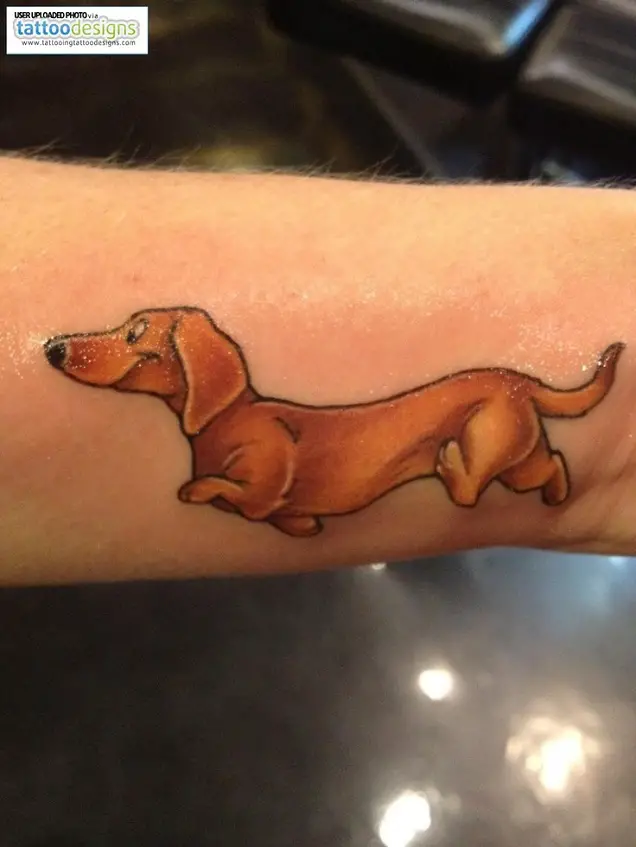animated running Dachshund tattoo on the forearm