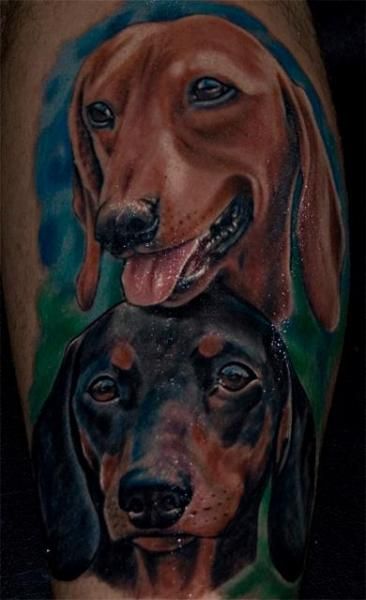 two 3D faces of Dachshunds tattoo on the leg