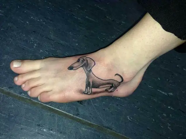 animated smiling black Dachshund tattoo on foot