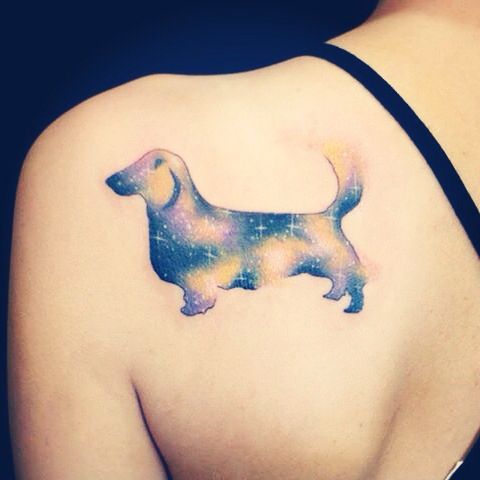 galaxy design Dachshund tattoo on the back