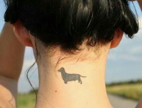 minimalist plain black Dachshund tattoo on the neck