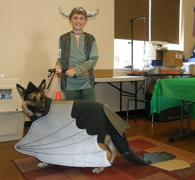 German Shepherd wearing a dragon outfit