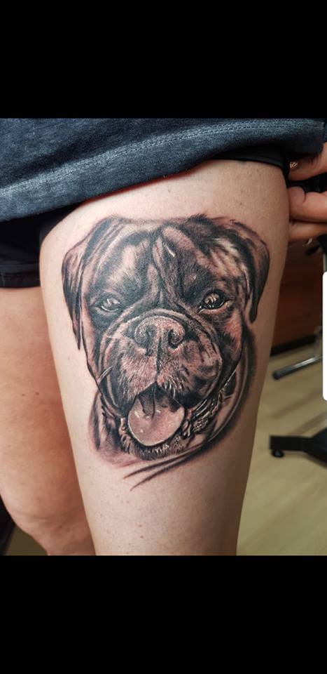 black Boxer Tattoo on thigh