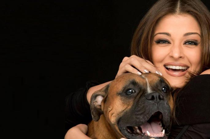 Aishwarya Rai (Bollywood Star) hugging her Boxer dog