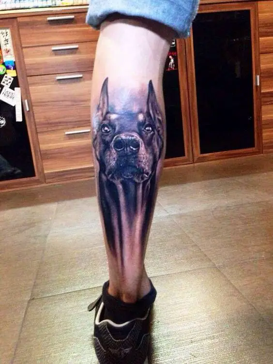 black and gray alert face of Doberman 3D tattoo on the leg