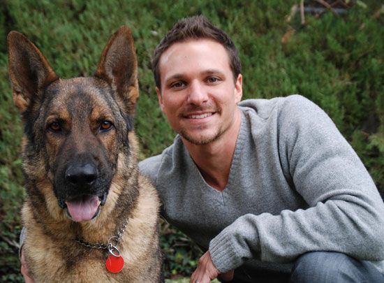 Drew Lachey beside his German Shepherd