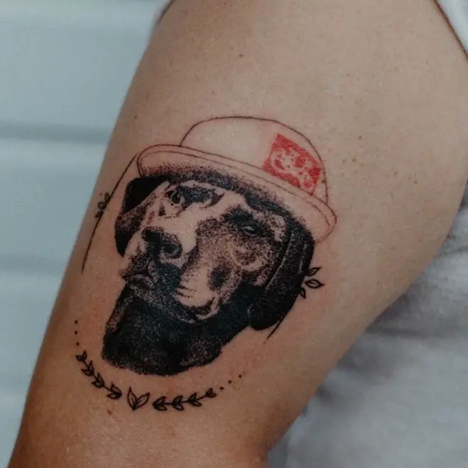 Labrador wearing a hat tattoo on the leg