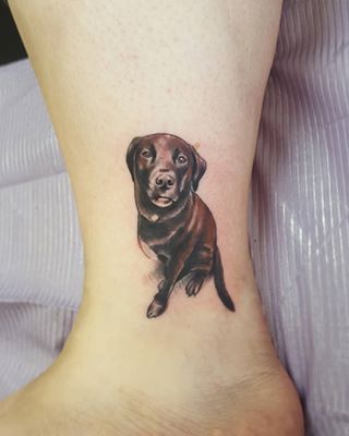 sitting chocolate brown Labrador tattoo on the ankle