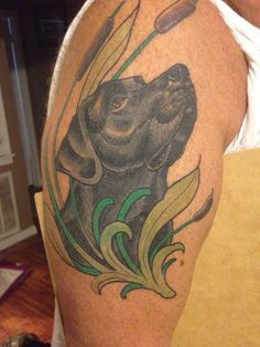 looking up Labrador tattoo on the shoulder