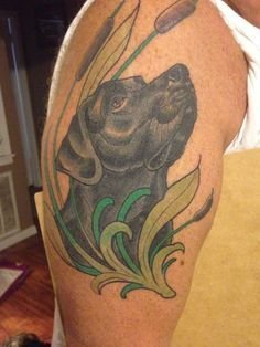 looking up Labrador tattoo on the shoulder