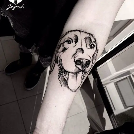 face of Labrador sketch tattoo on the forearm