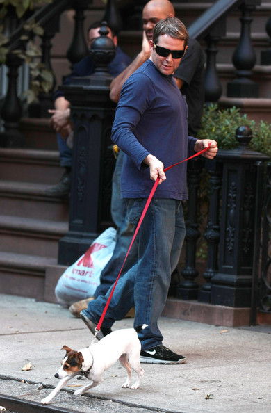 Matthew Broderick walking with his Jack Russell Terrier in the street