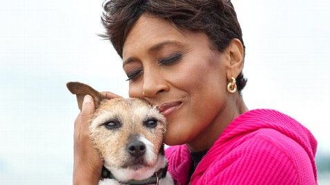 Nora Roberts kissing her Jack Russell Terrier on the head