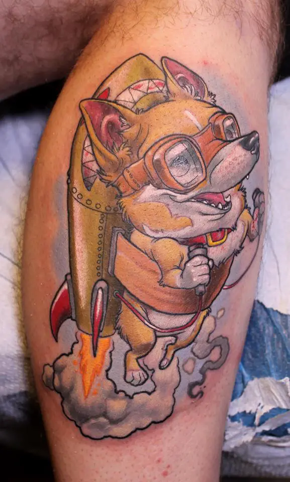 a corgi in a rocket tattoo on the leg of a man