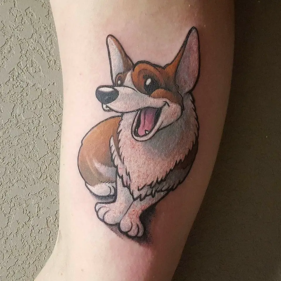 an animated sitting and smiling corgi tattoo on the biceps