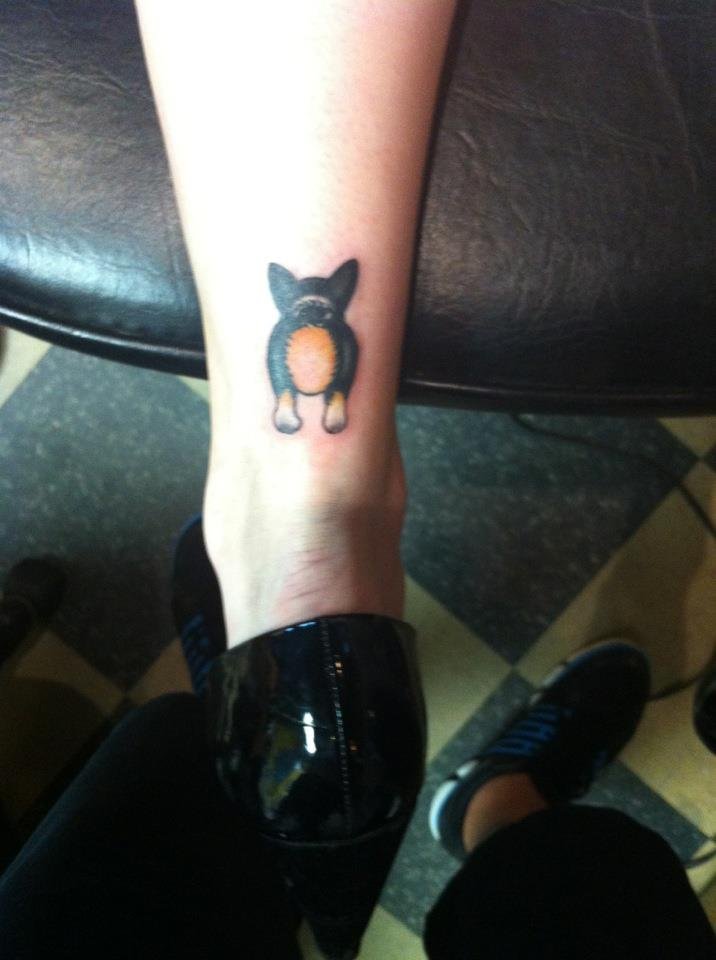 corgi butt tattoo on the leg