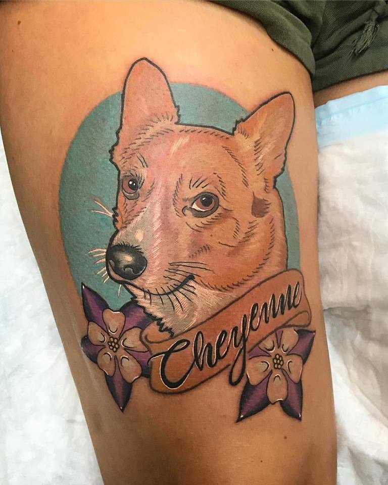 a corgi tattoo on the thigh