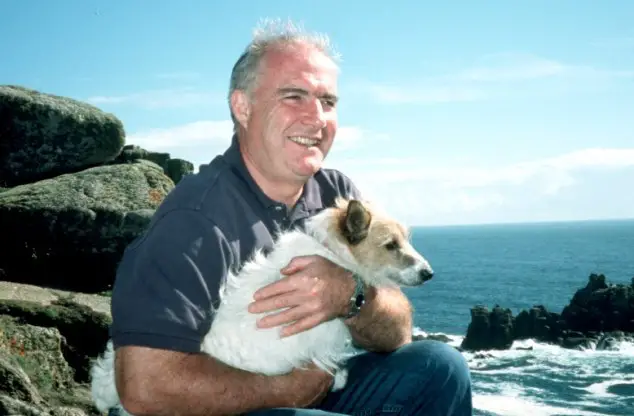Rick Stein holding his Jack Russell Terrier
