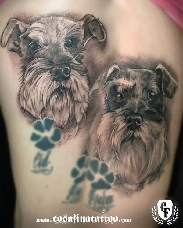 3D face of Schnauzer with paw prints tattoo on the thigh