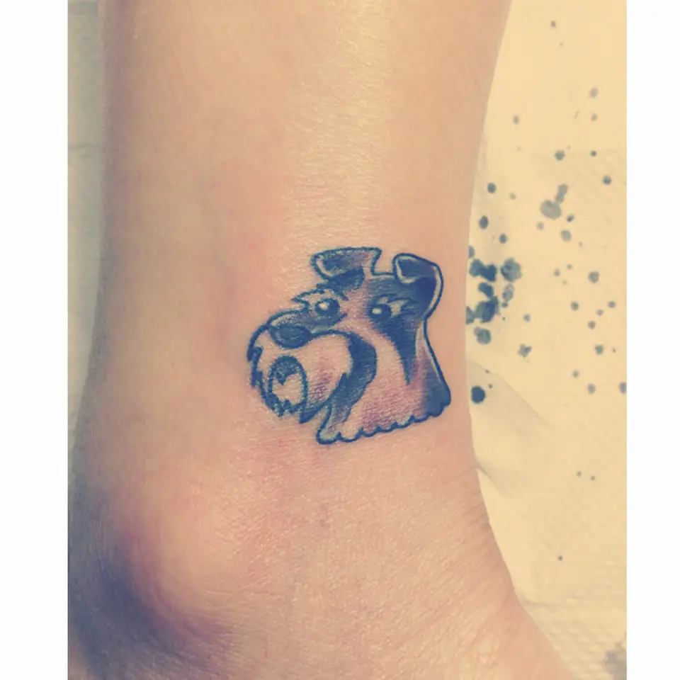 animated face of Schnauzer tattoo on the ankle