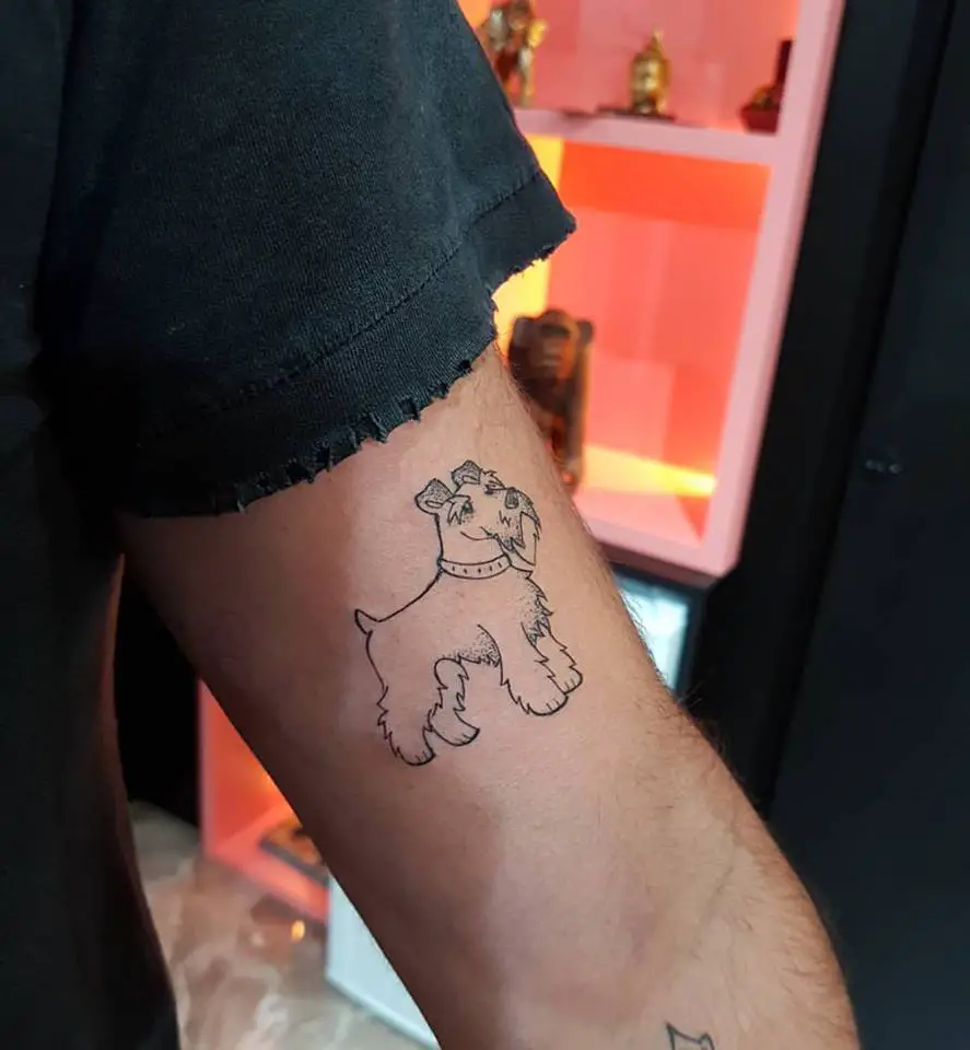 outline of Schnauzer tattoo on the biceps