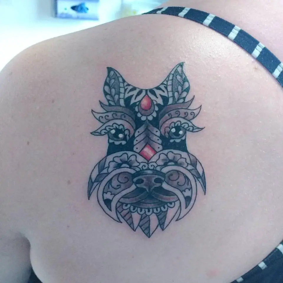 mandala designed face of Schnauzer tattoo on the back