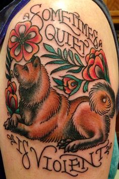 lying down Akita Inu Tattoo with flowers and quote 