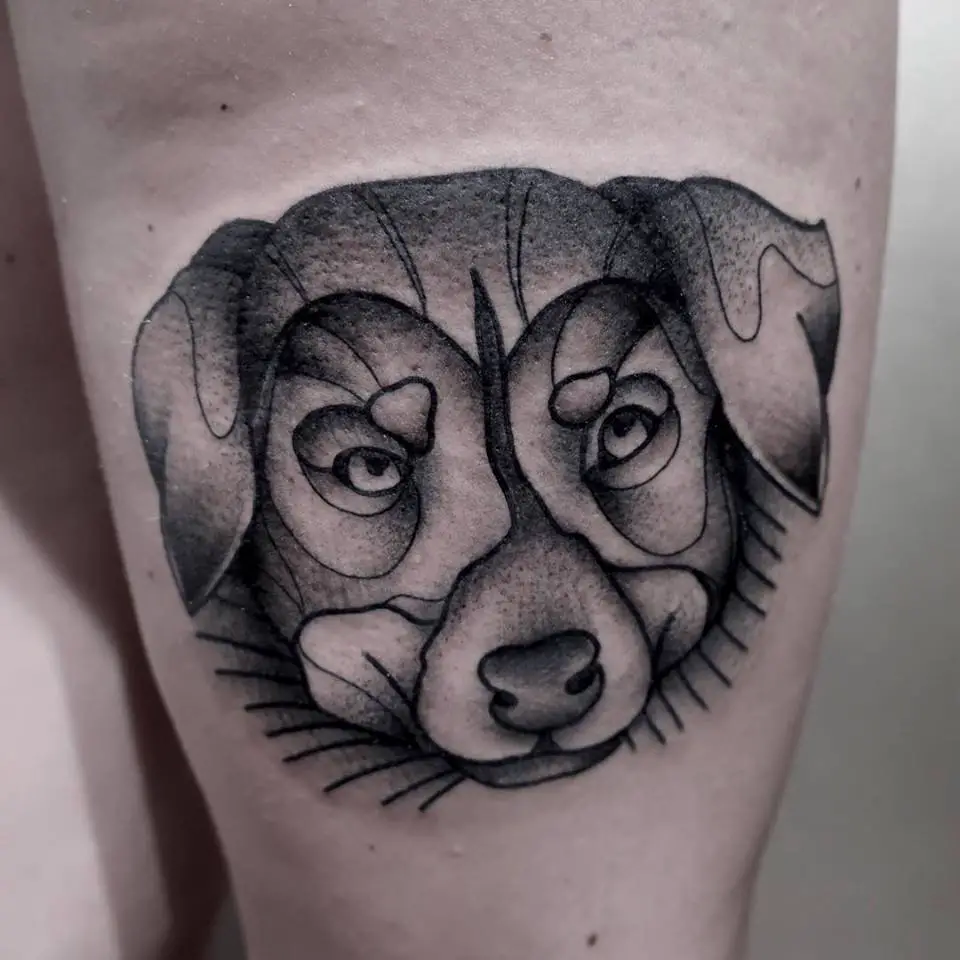 face of a Australian Shepherd puppy tattoo on thigh