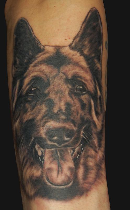 smiling face of a German Shepherd Dog Tattoo