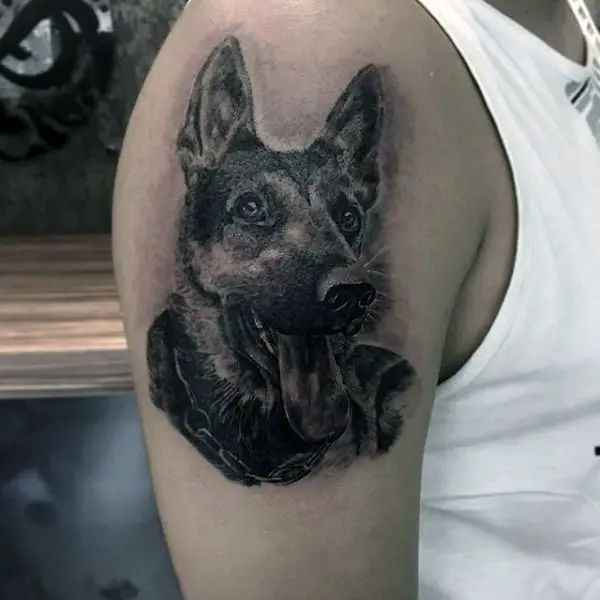 smiling with its tongue out German Shepherd Dog Tattoo on the shoulder