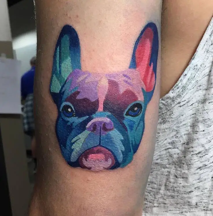 blue, purple, pink face of French Bulldog Tattoo on the back of the arm