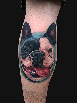 realistic smiling face of French Bulldog Tattoo on the leg