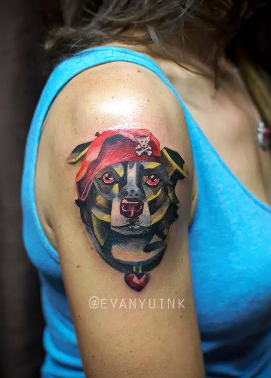 artistic face of a Border Collie wearing a red hat tattoo on the shoulder