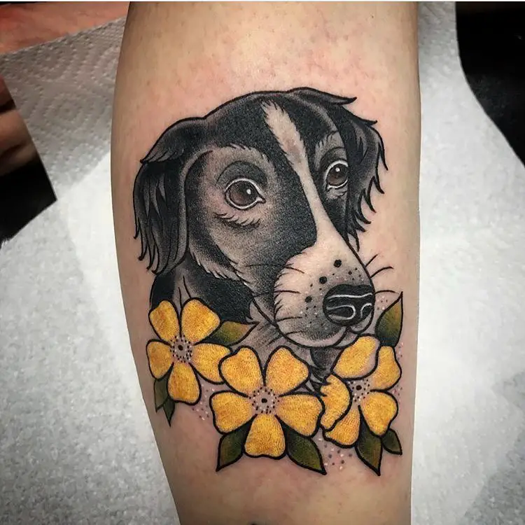 animated Border Collie with yellow flowers tattoo on the leg