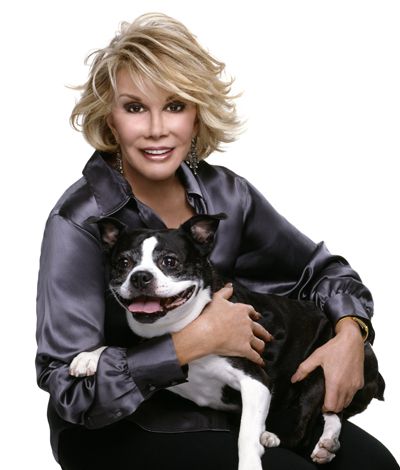 Joan Rivers sitting with her Boston Terrier in her lap