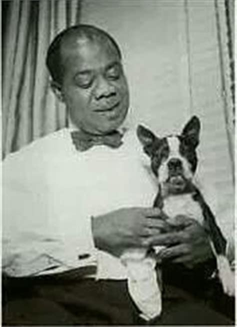 Louis Armstrong with his Boston Terrier sitting on his lap