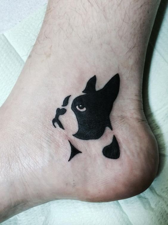 sideview face looking up Boston Terrier minimalist tattoo on the heel