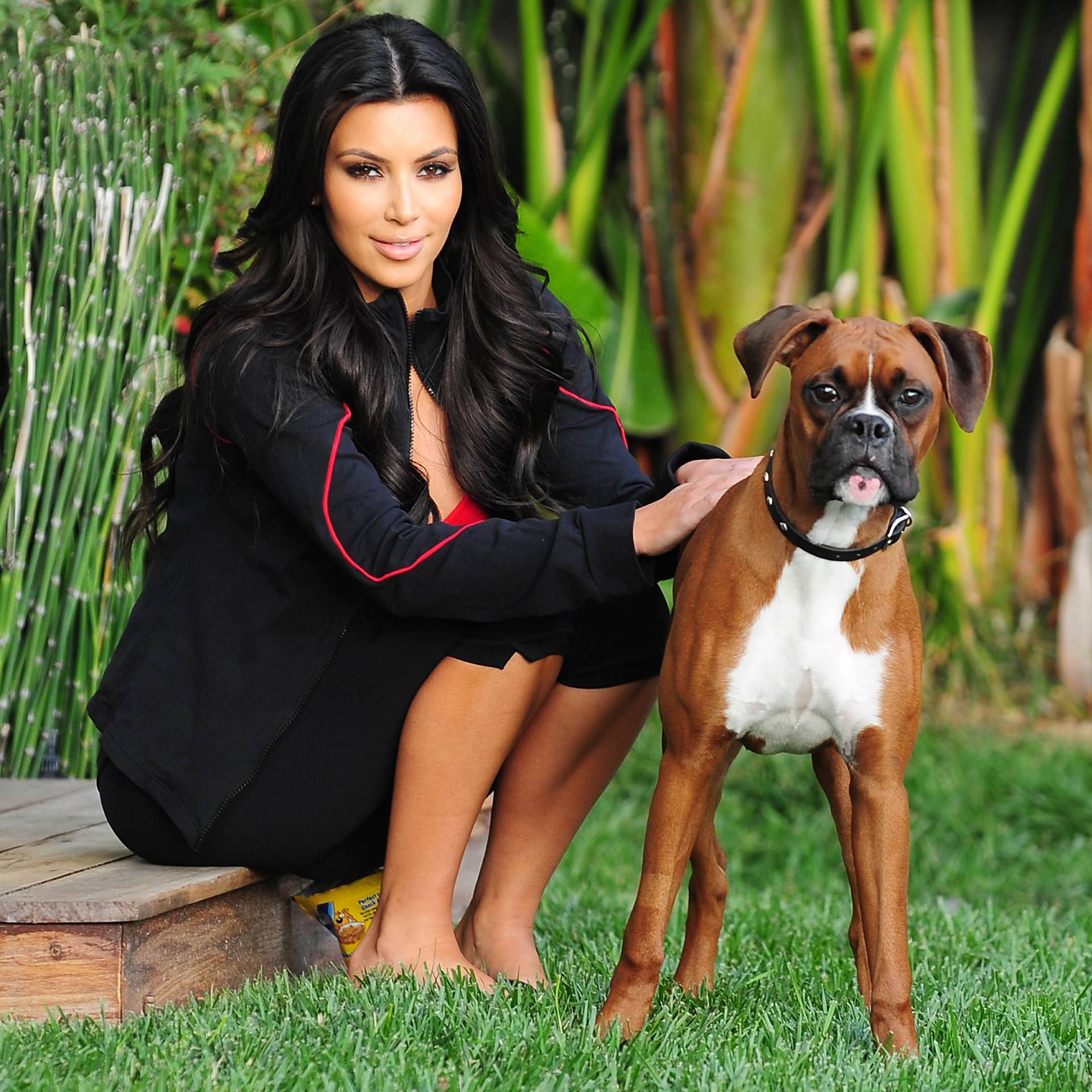 Kim Kardashian in the garden with her Boxer dog