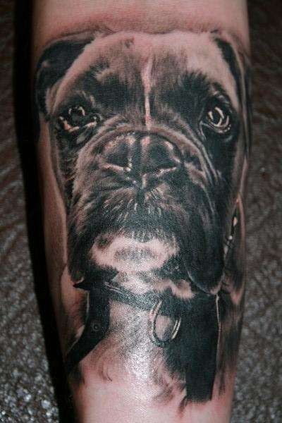 3D face of black Boxer dog tattoo on the leg