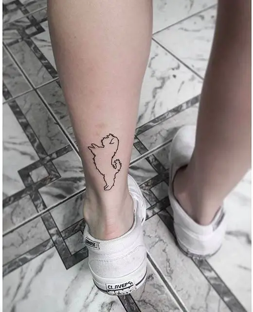 outline of standing Shih Tzu Tattoo on leg