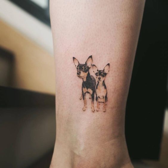 small two Chihuahua tattoo on the wrist
