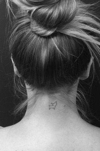 minimalist Chihuahua outline tattoo on the back of the neck