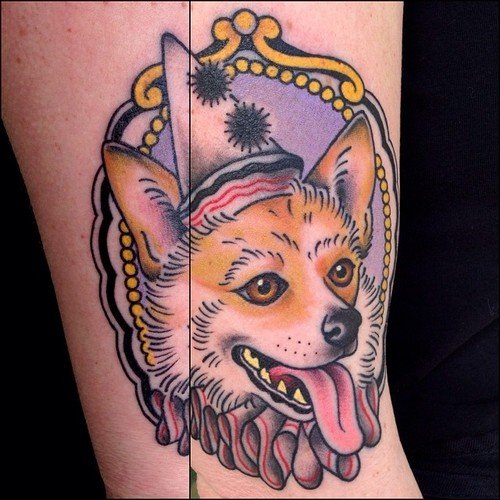 a corgi in a frame tattoo on the leg