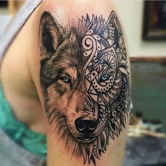 half realistic face of a Husky and half mandala tattoo on the shoulder