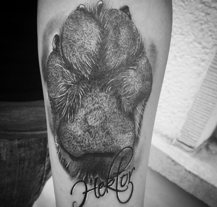 3D paw print tattoo with name on legs