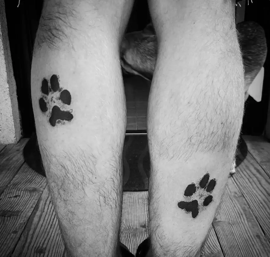paw print tattoos on legs