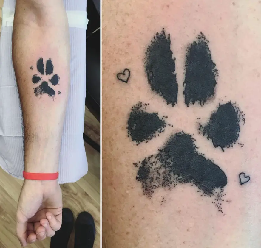 paw print tattoo on arms