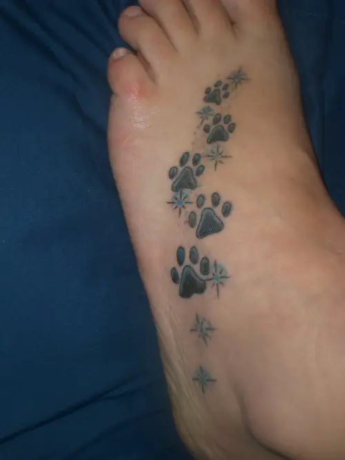 paw prints tattoo on the feet