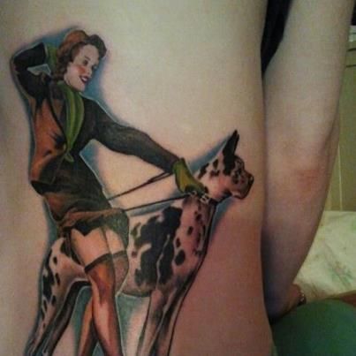 a young woman with a great dane 3D tattoo on the back