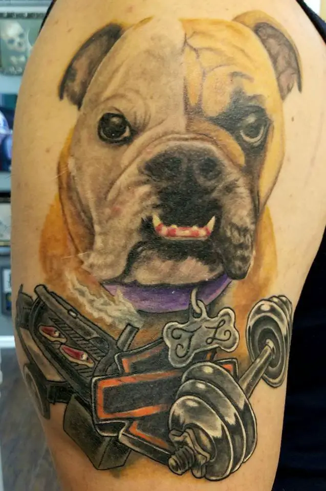 large angry face of an English Bulldog tattoo on the shoulder